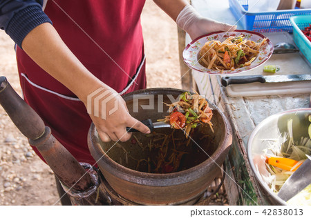 making papaya salad in a mortar, som tam making papaya salad in a mortar, som tam 42838013