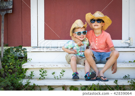 Mixed Race Chinese Caucasian Brothers Wearing Hats Mixed Race Chinese Caucasian Brothers Wearing Hats 42839064