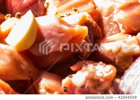 raw meat cut into pieces, pork prepared 42844509
