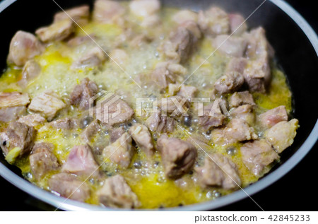 Juicy pork cut into pieces fried in butter Juicy pork cut into pieces fried in butter 42845233
