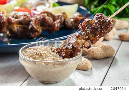 Traditional pork satay with peanut sauce Traditional pork satay with peanut sauce 42847014