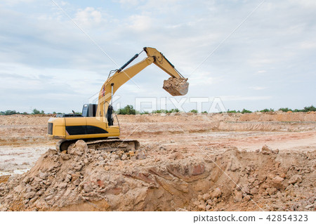 Yellow excavator machine working earth moving work Yellow excavator machine working earth moving work 42854323
