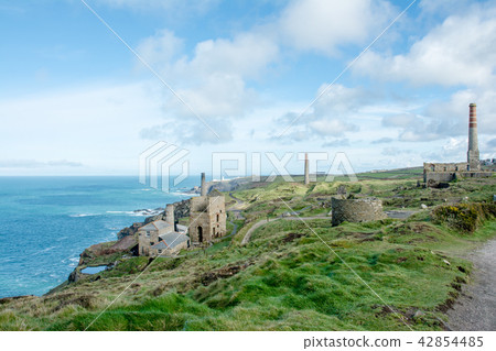 The rocky hill approaching the coast and the building of the ruined mine in the middle of it 42854485