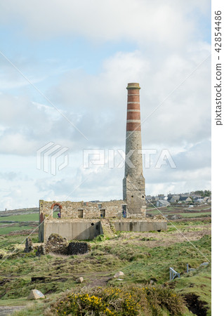 Ruin stone chimney no longer being used at Cornwall at the west end of the UK 42854486