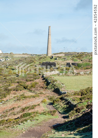 Ruin stone chimney no longer being used at Cornwall at the west end of the UK Ruin stone chimney no longer being used at Cornwall at the west end of the UK 42854592