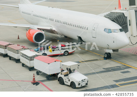 Loading cargo on plane in airport. cargo plane  42855735