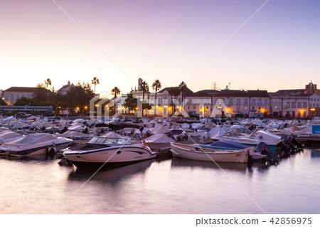 Sunset over the port in the bay, the town of Faro. Portugal. Sunset over the port in the bay, the town of Faro. Portugal. 42856975