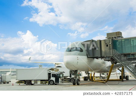 Loading cargo on plane in airport. cargo plane Loading cargo on plane in airport. cargo plane 42857175