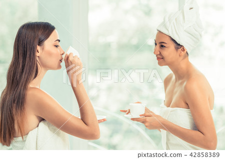Two women drinking tea in luxury day spa. 42858389