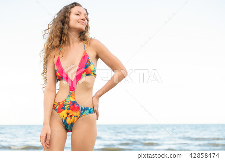 Happy young woman at beach in summer vacation. 42858474
