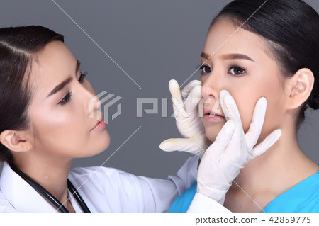 Beautiful Woman with Medical healthy Injection Treatment check nose skin v shape face before plastic surgery by doctor, Studio lighting white background isolated 42859775