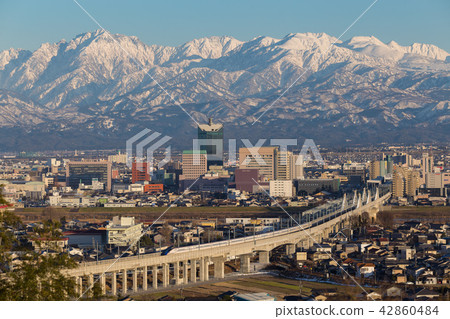 Evening scenery of Toyama-shi and Hokuriku Shinkansen Evening scenery of Toyama-shi and Hokuriku Shinkansen 42860484