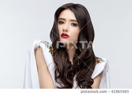 Brunette asian girl with long curly hair 42865983