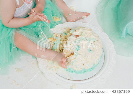 leg of baby food on white background.Feet and cake 42867399