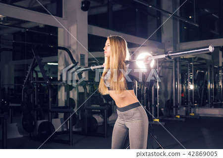 sport, fitness, training and happiness concept - sporty woman with barbell in gym sport, fitness, training and happiness concept - sporty woman with barbell in gym 42869005