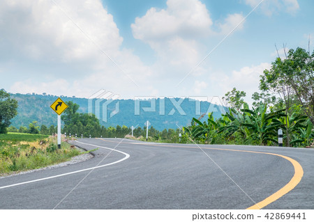 Sharp curve on the hill with asphalt road Sharp curve on the hill with asphalt road 42869441