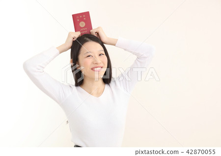 A woman with a passport A woman with a passport 42870055
