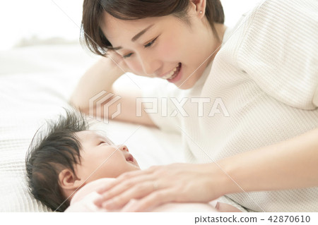 Baby taking a nap Family Families with parents and children 42870610