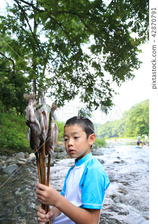 Children enjoying fishing Children enjoying fishing 42870791