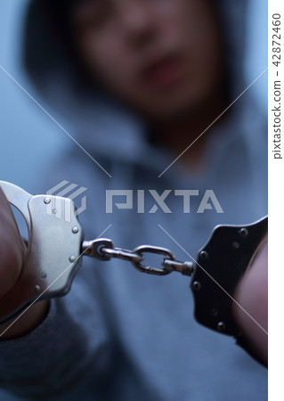 Arrest of handcuffs (crime illegal criminal bad suspect case criminal suspicious intruder thief face none thugs) Arrest of handcuffs (crime illegal criminal bad suspect case criminal suspicious intruder thief face none thugs) 42872460