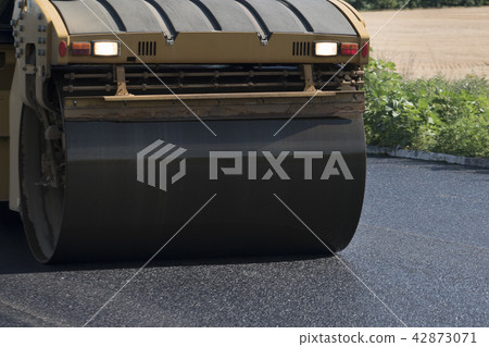 Road roller on asphalt. Summer sunny day 42873071