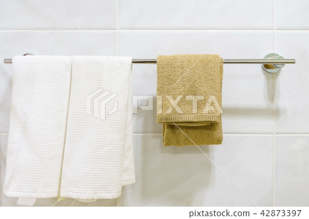 Clean white towel on a hanger prepared to use 42873397