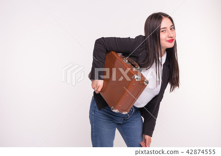 Suitcase, travel and people concept - Asian woman holding old brown suitcase on white background Suitcase, travel and people concept - Asian woman holding old brown suitcase on white background 42874555