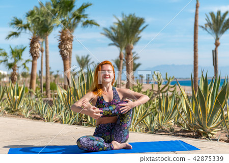 Woman doing yoga 42875339