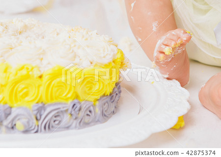 leg of baby food on white background.Feet and cake 42875374