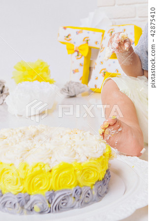 leg of baby food on white background.Feet and cake 42875410