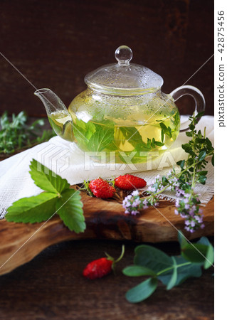 Healthy tea with medicinal herbs and strawberries 42875456