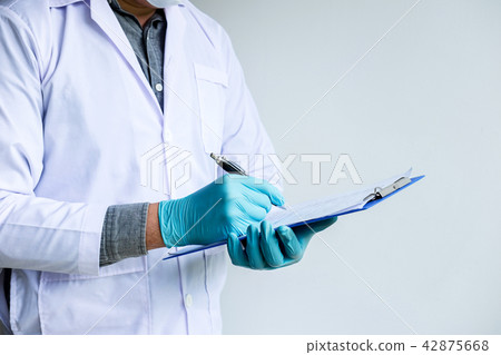Biochemistry laboratory research, Chemist is analyzing sample an 42875668