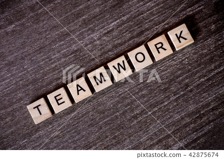 Concept presented by crossword with words teamwork with wooden c Concept presented by crossword with words teamwork with wooden c 42875674