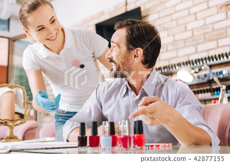 Cheerful mature man listening joke 42877155