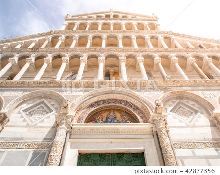 Front view of ornamental Romanesque portal of Pisa Cathedral - Roman Catholic cathedral dedicated to Front view of ornamental Romanesque portal of Pisa Cathedral - Roman Catholic cathedral dedicated to 42877356