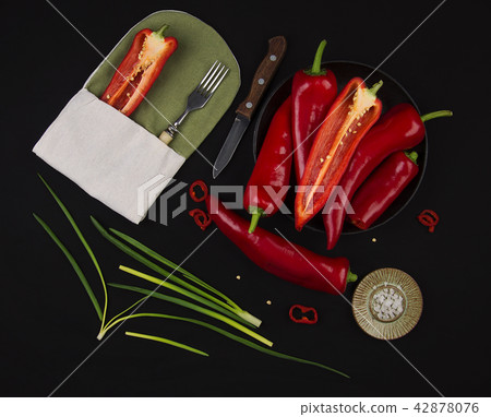 Fresh red pepper on black table Fresh red pepper on black table 42878076