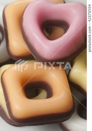 Donuts with icing and topping 42878504