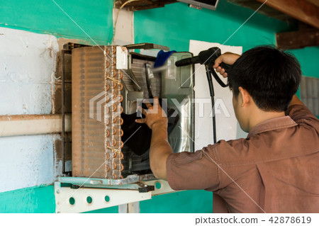 Technician are servicing repairing air conditioner 42878619