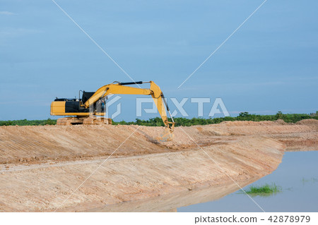 Yellow excavator machine working earth moving work Yellow excavator machine working earth moving work 42878979