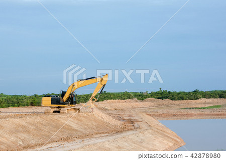 Yellow excavator machine working earth moving work Yellow excavator machine working earth moving work 42878980