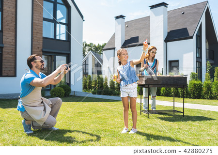 Nice pretty girl holding soap bubbles Nice pretty girl holding soap bubbles 42880275