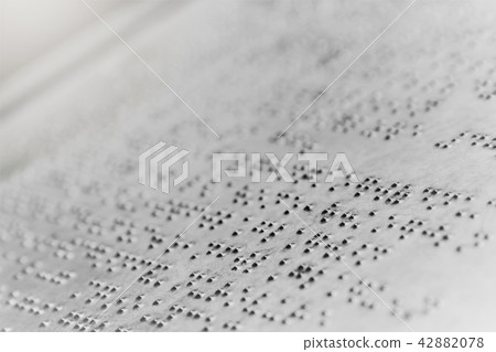 Close up braille text writing on iron plate background Close up braille text writing on iron plate background 42882078
