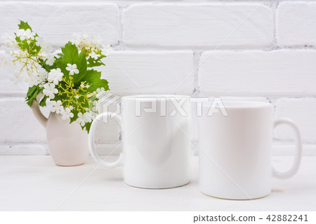 Two white coffee mug mockup with viburnum flowers 42882241