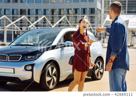 Happy nice woman taking the key Happy nice woman taking the key 42884111