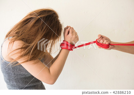 woman hostage pulled by red rope 42886210