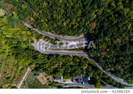 Winding road serpentine from a high mountain pass in the mosel village Brodenbach Germany Aerial 42886284