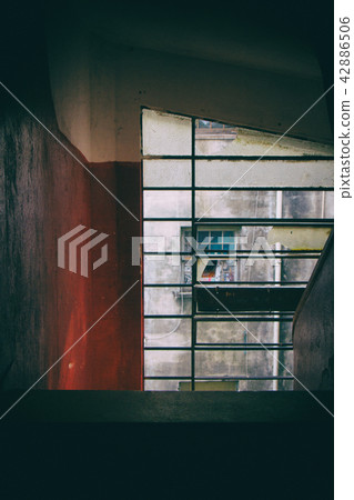 Window of a staircase in a residential building. Window of a staircase in a residential building. 42886506