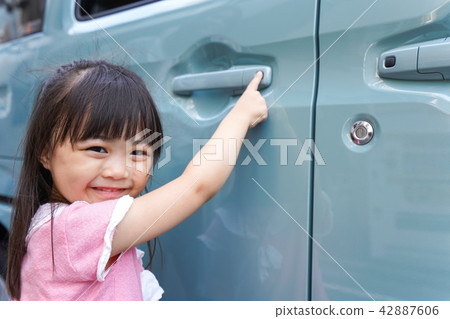 Children riding a car Children riding a car 42887606