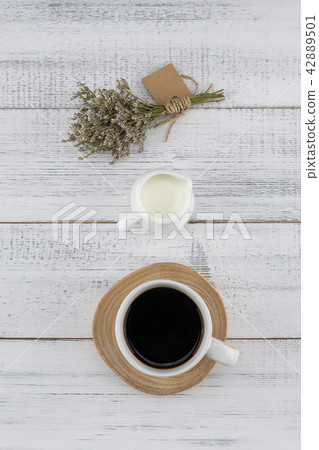 A cup of coffee and milk with caspia bouquet A cup of coffee and milk with caspia bouquet 42889501