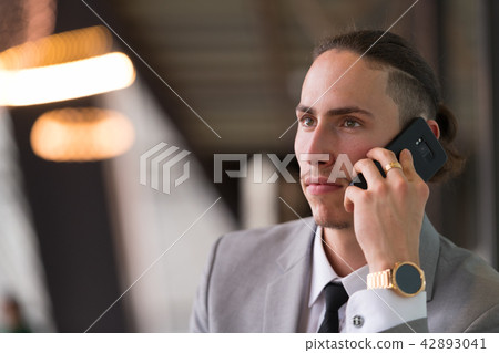 Young Handsome Businessman Talking On Phone 42893041